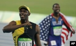 Jamaica's Usain Bolt celebrates winning the men's 100-meter final during the athletics competitions of the 2016 Summer Olympics at the Olympic stadium in Rio de Janeiro, Brazil, Aug. 14, 2016.