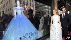 The stars of Disney's film "Cinderella," Lily James and Richard Madden, unveil themed store windows at Saks Fifth Avenue in New York, March 9, 2015.