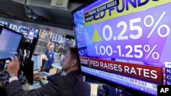 The rate decision of the Federal Reserve is shown on a television on the floor of the New York Stock Exchange, June 14, 2017.