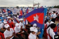 In this July 7, 2018, file photo, supporters wait for the start of a campaign rally of Cambodian Prime Minister Hun Sen's Cambodian People's Party in Phnom Penh, Cambodia.