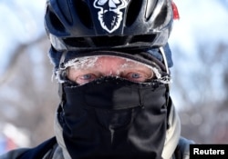 Don Wolford rides his bike to work in frigid temperatures in Fargo, North Dakota, U.S., January 31, 2019. REUTERS/Dan Koeck