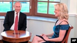 NBC journalist Megyn Kelly, right, smiles during an interview with Russian President Vladimir Putin in the Constantine Palace at the St. Petersburg International Economic Forum in St. Petersburg, Russia, June 1, 2017.