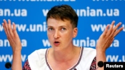 FILE - Ukrainian pilot Nadiya Savchenko, freed this year from a Russian prison, met with rebel leaders before Tuesday's release of two women held under suspicion of spying.