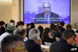 U.N. Special Rapporteur on Palestine Michael Lynk delivers a video message on May 18, 2018, in Geneva, during a special session of the U.N. Human Rights Council.