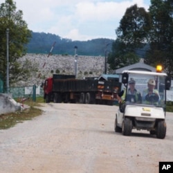 Truckloads of radioactive waste are still being taken to bury beneath the granite wall today, although the rare earth mining factory has closed down.