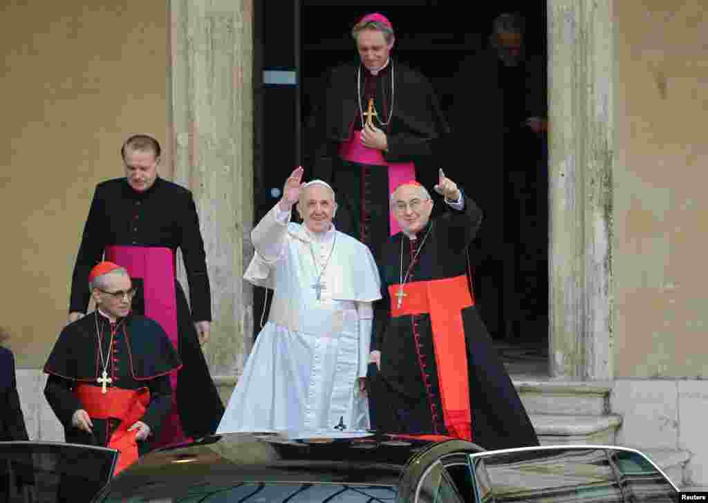 Newly elected Pope Francis waves from the steps of the Santa Maria Maggiore Basilica in Rome, March 14, 2013.
