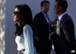 Democratic presidential nominee Hillary Clinton's aide, Huma Abedin, arrives for the presidential debate between Democratic nominee Hillary Clinton and Republican nominee Donald Trump at Hofstra University in Hempstead, N.Y., Sept. 26, 2016.