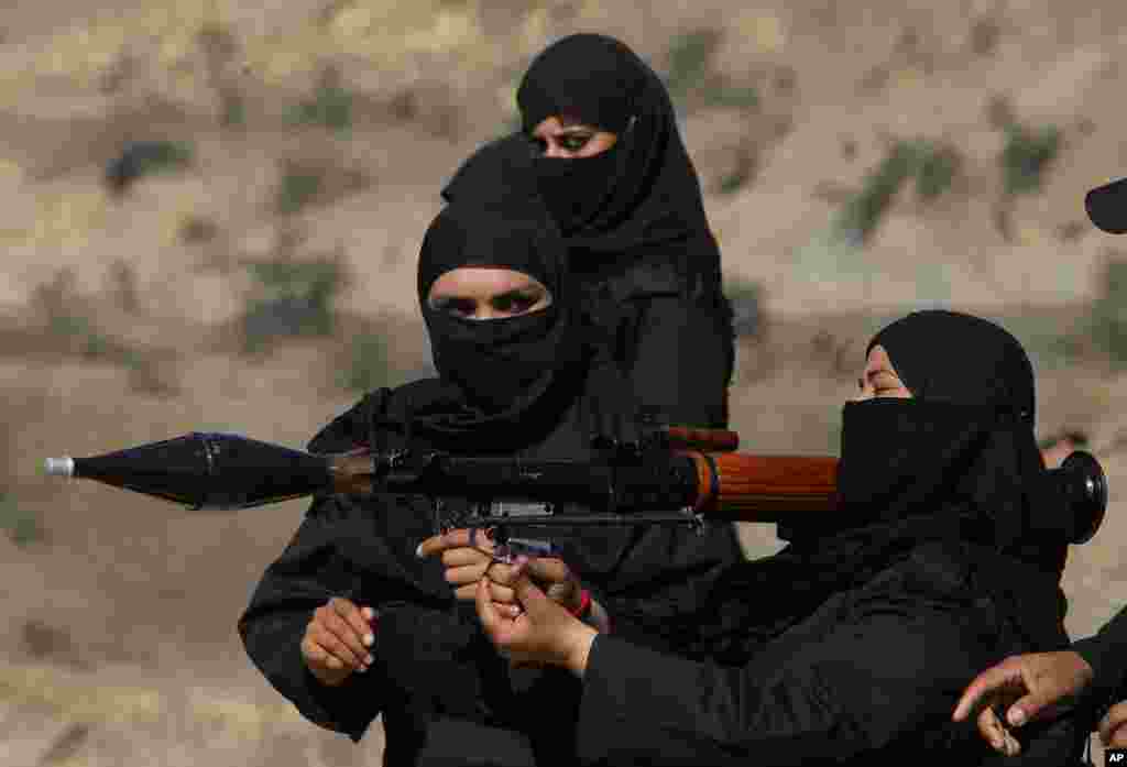 Pakistani female police commandos attend a training session in Nowshera, near Peshawar.