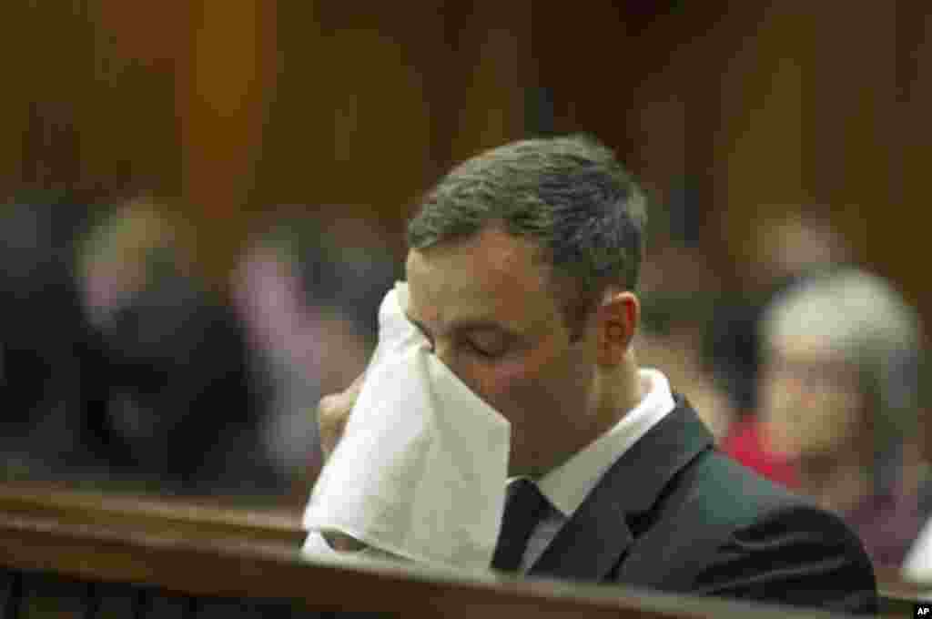 Oscar Pistorius sits in court for the last day of sentencing procedures where the defense and prosecution will put their case for and against sentencing, in Pretoria, South Africa, Friday, Oct. 17, 2014. Pistorius was found guilty last month of culpable h