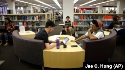 FILE - Students study for their exams at the Cal State Northridge campus in Los Angeles on Thursday, May 12, 2016. The largest university system in the United States, announced that it will move all fall season classes online because of the coronavirus. (AP Photo/Jae C. Hong)