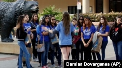  A bioengineering student leads prospective college-bound high school seniors on a campus tour in Los Angeles. Fewer California high school students have been offered admission to University of California campuses for the fall, officials reported