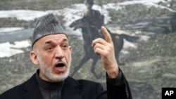 Afghan President Hamid Karzai speaks during a press conference at the presidential palace in Kabul, Afghanistan, January 14, 2013. 