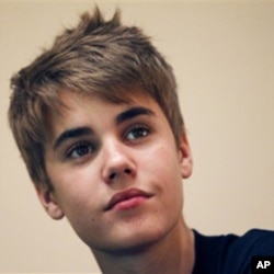 FILE - In this April 19, 2011 file photo, pop star Justin Bieber gives a press conference before his concert as part of his "My World" tour in Singapore. Australian officials have charged a teenager with breaking into a Justin Bieber concert and throwing