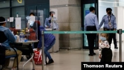 Passengers from overseas arrive at the Incheon International Airport, amid the coronavirus disease (COVID-19) pandemic in Incheon, South Korea, Dec. 28, 2020. 