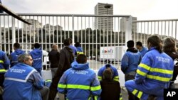 Dockers from Marseille block the way to the harbour during a strike to protest against the implementation of harbour reforms and ask for the recognition of the hardship at work, an important factor for pensions, 01 Oct. 2010