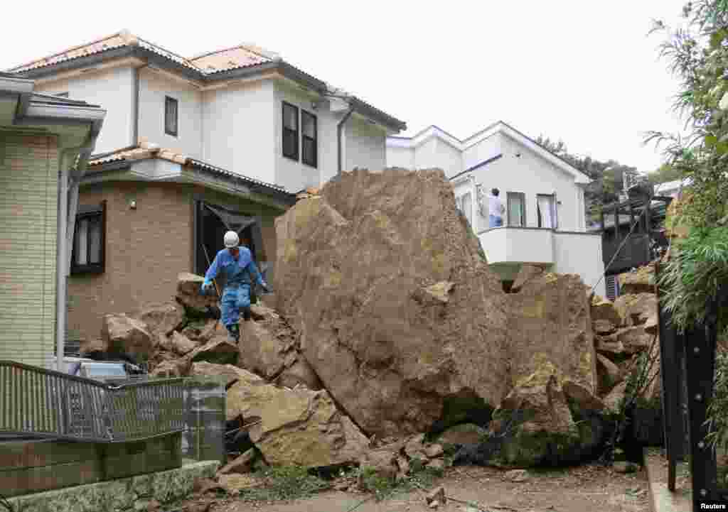 Rocks are seen in a residential area following a landslide caused by Typhoon Wipha in Kamakura, south of Tokyo, in this photo taken by Kyodo, Oct. 16, 2013. 