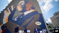 People gather at a make-shift memorial near the home of Rep. John Lewis, D-Ga., July 19, 2020, in Atlanta.