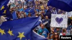 FILE - Pro-Europe demonstrators protest during a "March for Europe" against the Brexit vote result earlier in the year, in London, Sept. 3, 2016. 