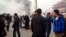 Smoke rises near the main entrance of the Forbidden City at Tiananmen Square in Beijing Oct. 28, 2013,after a car ploughed into pedestrians and caught fire.