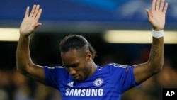 Chelsea's Didier Drogba celebrates after scoring during the Champions League Group G soccer match between Chelsea and NK Maribor at Stamford Bridge stadium in London Tuesday, Oct. 21, 2014.