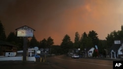 FILE - Smoke from the Line Fire fills the air in Running Springs, California, Sept. 7, 2024.