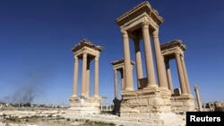 FILE - A view shows the Tetrapylon, one of the most famous monuments in the ancient city of Palmyra, Syria, April 1, 2016. 