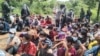 In this handout photo from the Royal Thai Army taken and released on Nov. 1, 2021, Myanmar migrants are pictured after being apprehended by Thai military personnel in Kanchanaburi province, bordering Myanmar. 