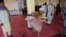 Devotees are seen inside a mosque after a bomb blast on the outskirts of Kabul, May 14, 2021, that killed at least 12 people, shattering the relative calm of a holiday cease-fire between the warring Taliban and government forces. 