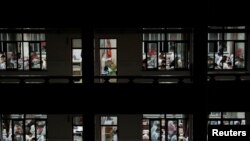 FILE - Students study in the evening ahead of China's annual National College Entrance Exam, also known as "Gaokao", at a school in Nantong, Jiangsu province, China May 22, 2017.