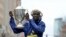 Lawrence Cherono, of Kenya, holds the trophy after winning the 123rd Boston Marathon, on April 15, 2019, in Boston. 