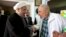 Cuba's former leader Fidel Castro, right, shakes hands with Iranian President Hassan Rouhani in Havana, Cuba, Monday, Sept 19, 2016.