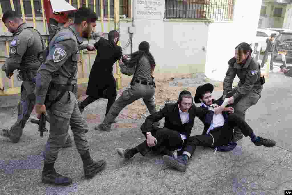 Members of the Israeli security personnel detain ultra-Orthodox protesters during a demonstration against conscription in Jerusalem.&nbsp;Historically exempt from compulsory military service, ultra-Orthodox seminary students are being called up amid Israel&#39;s war with Hamas and Hezbollah.