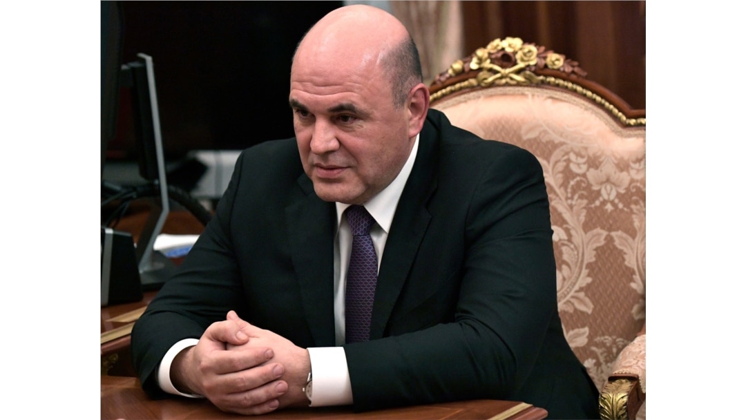 Russian Tax Service chief Mikhail Mishustin listens to Russian President Vladimir Putin (not pictured) during their meeting in the Kremlin in Moscow, Russia, Jan. 15, 2020.