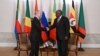 Russian President Vladimir Putin shakes hands with South African President Cyril Ramaphosa during a meeting with African leaders in Saint Petersburg , June 17, 2023.