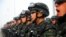 Paramilitary policemen stand in formation as they take part in an anti-terrorism oath-taking rally, in Kashgar, Xinjiang Uighur Autonomous Region, China, February 27, 2017.