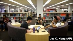 Students Sean Aitchison, left, and Alex Aguilar study for their final exams at the newly-renovated Oviatt Library on the Cal State Northridge campus in Los Angeles on Thursday, May 12, 2016. The facility underwent a five-year renovation that included flex