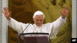 Pope Benedict XVI waves to faithful during the Angelus prayer from the window of his Castel Gandolfo summer palace, on the outskirts of Rome, Sunday, Sept. 11, 2005. 