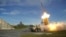 FILE - A Terminal High Altitude Area Defense (THAAD) interceptor is launched during a successful intercept test, in this undated handout photo provided by the US Department of Defense.