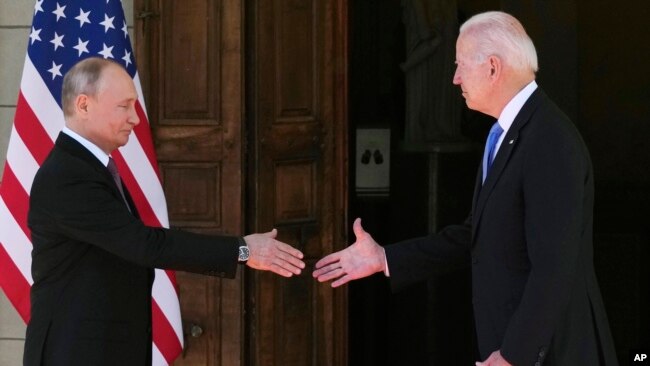 FILE - President Joe Biden, right, and Russian President Vladimir Putin arrive to meet at the 'Villa la Grange', in Geneva, Switzerland, June 16, 2021.