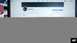 An Australian Broadcasting Corporation page on Facebook is displayed without posts in Sydney, Thursday, Feb. 18, 2021. Facebook is vowing to restrict news sharing as Australian lawmakers consider forcing digital giants into payment agreements. (AP…