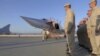 Russian service members line up after the landing of a Tupolev Tu-22M3 long-range bomber at the Hmeymim air base in west Syria, May 25, 2021.