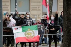 FILE - Demonstrators of an Iranian opposition group protest near the Grand Hotel Wien where closed-door nuclear talks with Iran take place in Vienna, Austria, April 15, 2021.