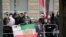 Members of an Iranian opposition group protest near the 'Grand Hotel Wien' where closed-door nuclear talks with Iran take place in Vienna, Austria, April 15, 2021. 
