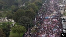 Thousands of people march against domestic violence in Lima, Peru, Aug. 13, 2016.
