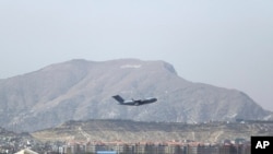 A U.S military aircraft takes off at Hamid Karzai International Airport in Kabul, Afghanistan, Aug. 28, 2021. The massive U.S.-led airlift was winding down Saturday ahead of a U.S. deadline to withdraw from Afghanistan by Tuesday. 