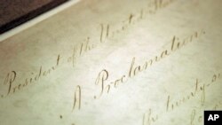 FILE — The original Emancipation Proclamation is shown on display in the Rotunda of the National Archives in Washington, February 18, 2005. 