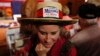 Supporter Sherri Martin, of Mobile, Ala., waits for U.S. Senate candidate Roy Moore to speak at a campaign rally, Dec. 5, 2017, in Fairhope Ala. 