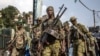 Members of the M23 movement monitor the area following the takeover of the city at the Place de l'Independance in Bukavu on Feb. 20, 2025. 