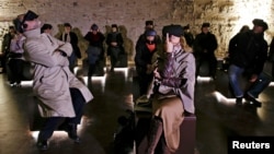People wear virtual reality devices inside the Domus Aurea, built by Roman Emperor Nero in 64 A.D. and later buried by Emperor Trajan in Rome, Italy, Jan. 31, 2017.