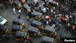 Autorickshaws much like these in central Hyderabad, India, are scheduled for a February 2013 pilot-program launch in the trendy Melville suburb of Johannesburg, South Africa, March 6, 2012.